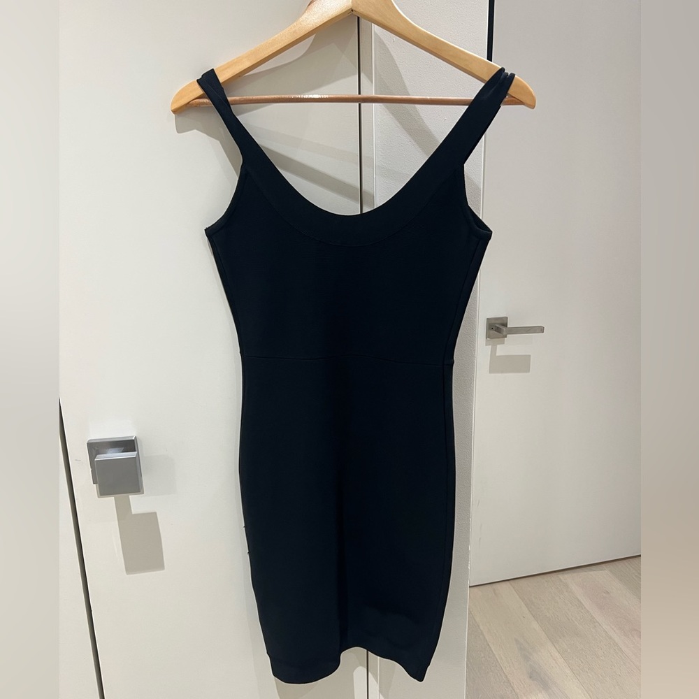 Figure-defining and bodycon black tank dress.